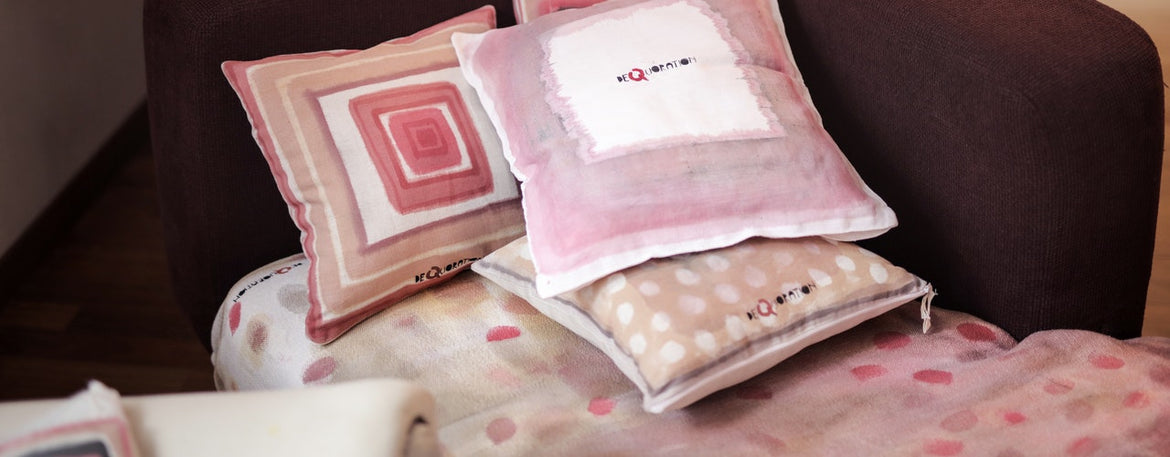 Loving family of four making bed